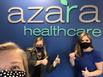 Azara team infront of the Azara Healthcare sign