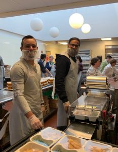 Azara employees packaging food
