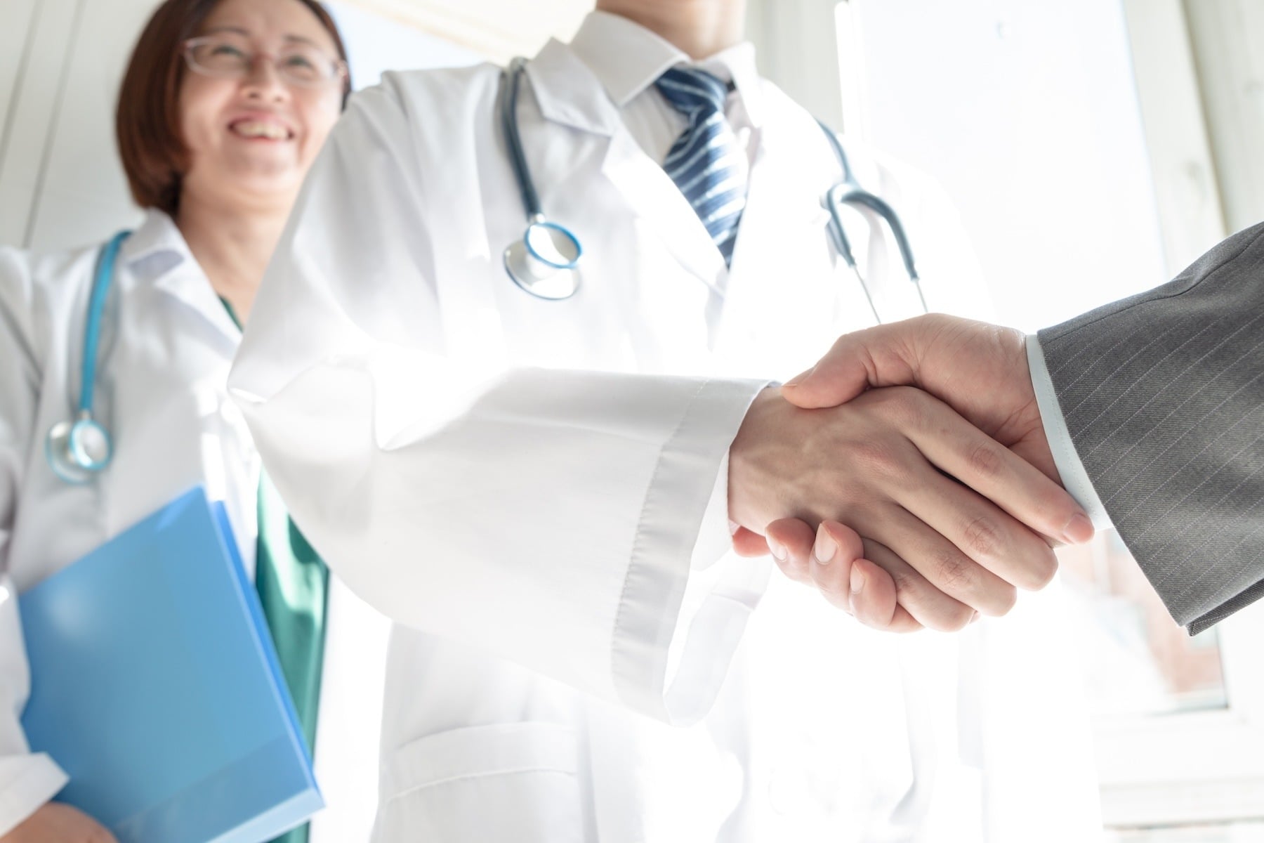 Image of professionals shaking hands