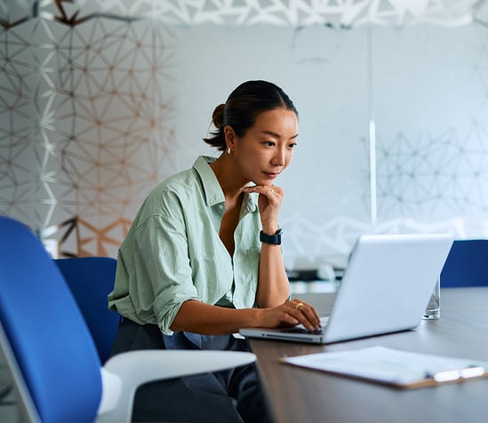 woman-at-laptop-calculator woman-at-laptop-calculator